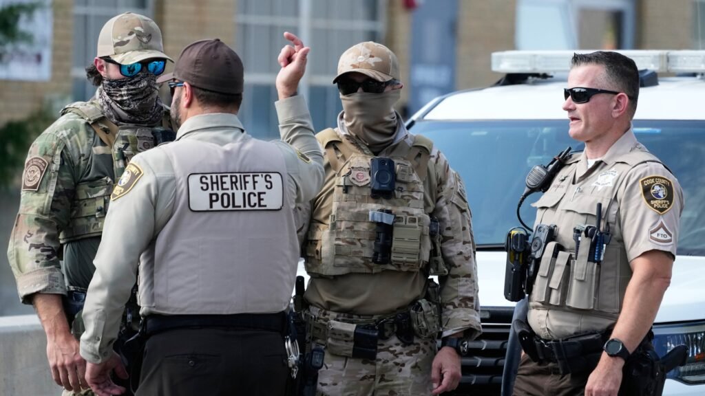 A court says National Guard troops sent to Illinois by President Trump can stay under federal control, but they can't be deployed.