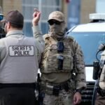 A court says National Guard troops sent to Illinois by President Trump can stay under federal control, but they can't be deployed.